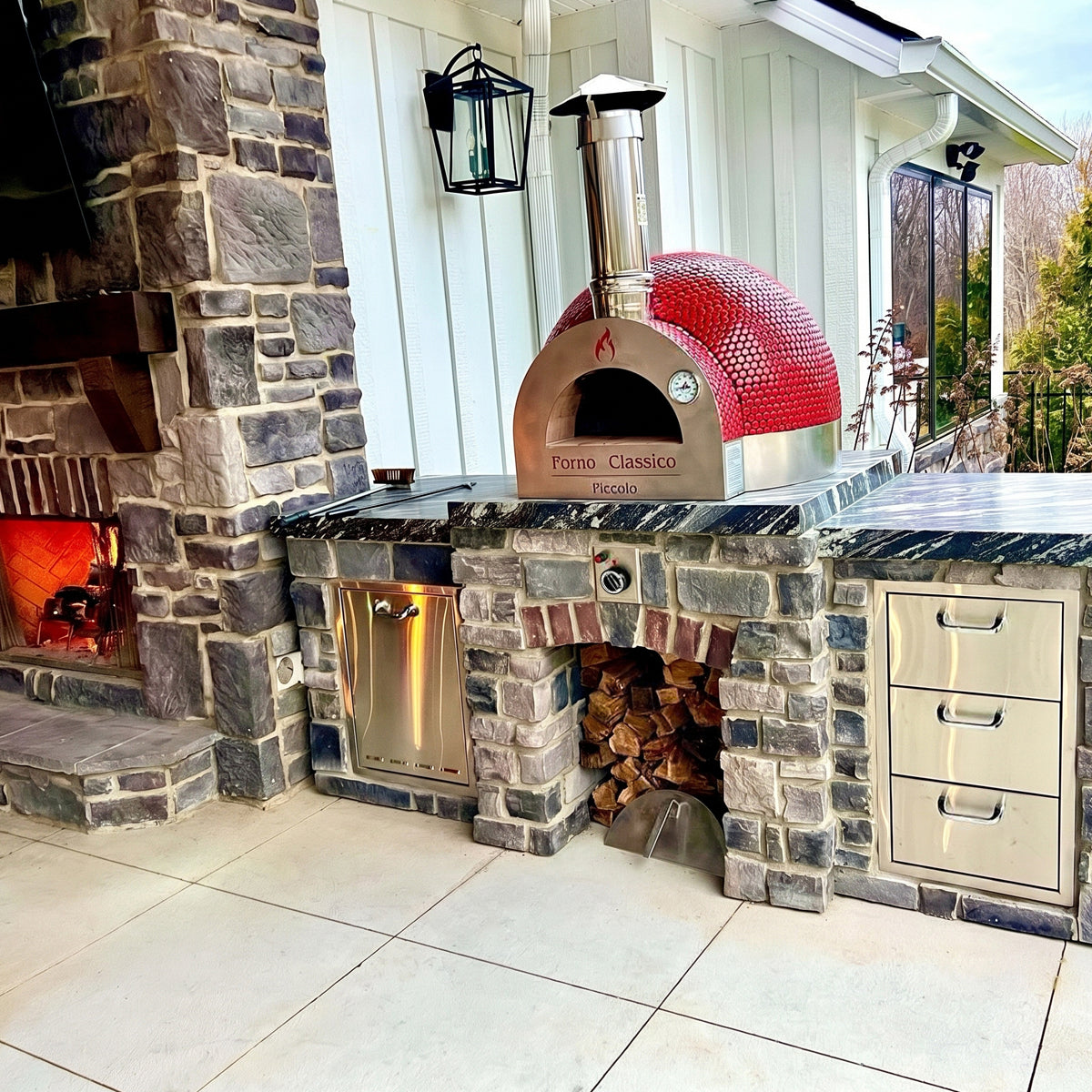 Outdoor kitchen with a Forno Classico Piccolo pizza oven and grills